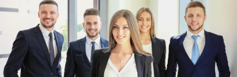 Professional employees wearing branded corporate uniforms in a customer-facing business environment